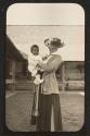 Oak Lodge guest holding African American baby, Oak Lodge Trip