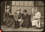 George Eastman and women guests on porch, Oak Lodge Trip