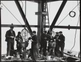 [Workers eating lunch by rivet forges, Empire State Building]