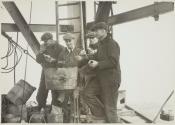 [Workers eating lunch by rivet forges, Empire State Building]