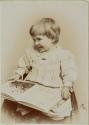 [Child with book]