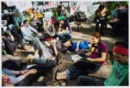 May 1, 2012, Demonstrators rest in Union Square Park. Approximately 20,000 people gathered to celebrate May Day, the International Labor Day, and to protest economic inequality as part of the Occupy Wall Street movement.
