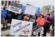 Washington, DC, A circus-like atmosphere was on display in front of the Supreme Court as demonstrators for and against President Obama's health-care law made their voices heard.