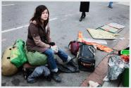 Washington, DC, Melissa Millard from Tallahassee , Florida, sits with her belongings. She plans to go back to Florida and then return to Occupy D.C. in a few months.