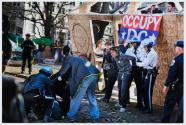 Washington, DC. U.S. Park Police arrest protesters who broke through the police line in an effort to join fellow Occupy D.C. protesters barricaded in a wooden structure they erected in McPherson Square.
