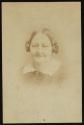 [Woman with hair braided on sides of head]