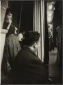 [Manager of El Morocco nightclub watching performers on stage]