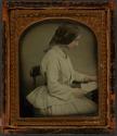 [Woman in profile reading letter]