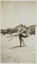 [Man and two women at beach]