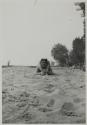 [Woman on sand]