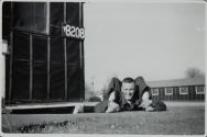 [Man next to building]