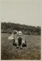 [Man in front of a basket]