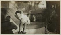[Misha sitting on ledge]