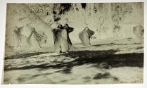 [Veiled figures]