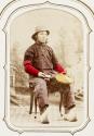 [Man holding basket]