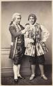 [Two men in theater costume]