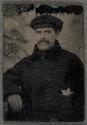 [Man wearing fisherman cap]