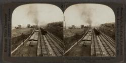 [A Busy Path of Commmerce in Central New York—Four Track Railway, Electric Road at Right, Erie Canal at Extreme Left]