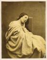 [Cloth-draped woman]