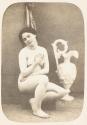 [Nude woman with urn]