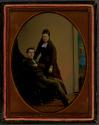 [Sitting man with standing woman]