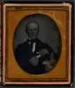 [Man making paper cartridges (possibly gunsmith)]