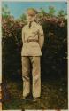 [Uniformed man in garden]