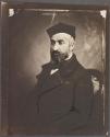 [Bearded man in hat]