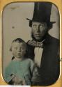 [Man, wearing top hat, and child]