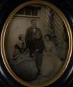 [Outdoor portrait of man, two women, and boy]