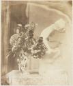 [Still life, flowers and statue]