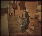 [Charlie Chaplin as The Tramp]