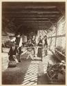 [Men and woman bottling kirsch]