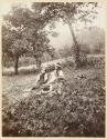 [Children in grassy field]