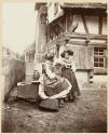 [Two women at fountain]