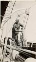 Man polishing stack of launch, Labrador Trip