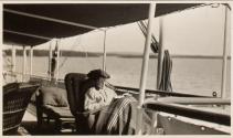 Eleanor Eastwood in chair on deck of yacht, Labrador Trip