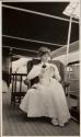 Mary Mulligan in wicker chair on yacht, Labrador Trip