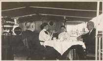 George Eastman and companions dining on deck of the Surf, Labrador Trip