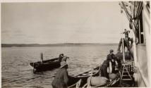 Boats being loaded from yacht, Labrador Trip