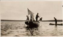 Men in steam launch & man in canoe, Labrador Trip