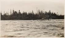 Fishing companions poling a canoe, Labrador Trip