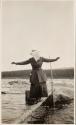 Companion balancing on log, Labrador Trip