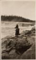 Companion fishing on riverbank, Labrador Trip
