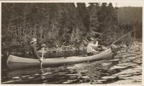 Companions paddling canoe, Labrador Trip