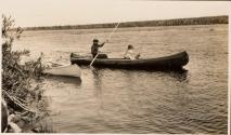 Men in canoe, one fishing, Labrador Trip