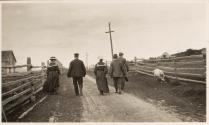 George Eastman & companions walking on road, Labrador Trip
