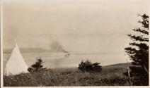 View of yacht steaming away from cove, Labrador Trip