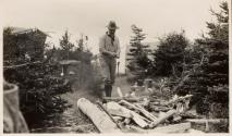Man beside campfire, Labrador Trip