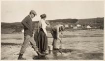 Travel companions digging for clams, Labrador Trip